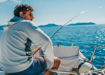 when hunting from a boat, what is the best way to maintain the boat's stability?